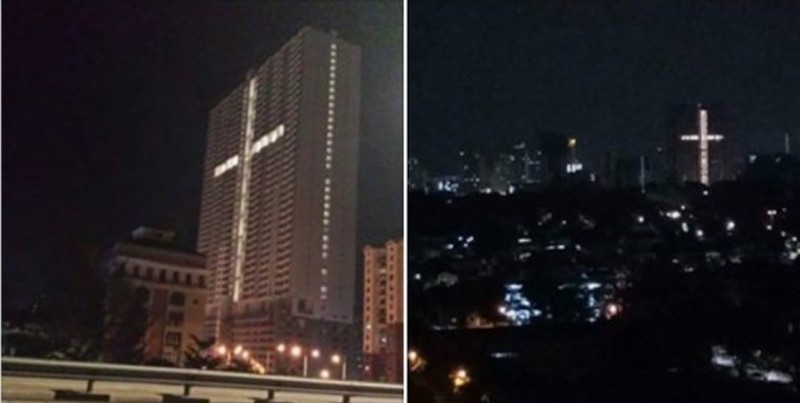 An image of a cross formed by lights in a building in Jelutong have caused consternation among some residents in the surrounding area. — Composite via Facebook