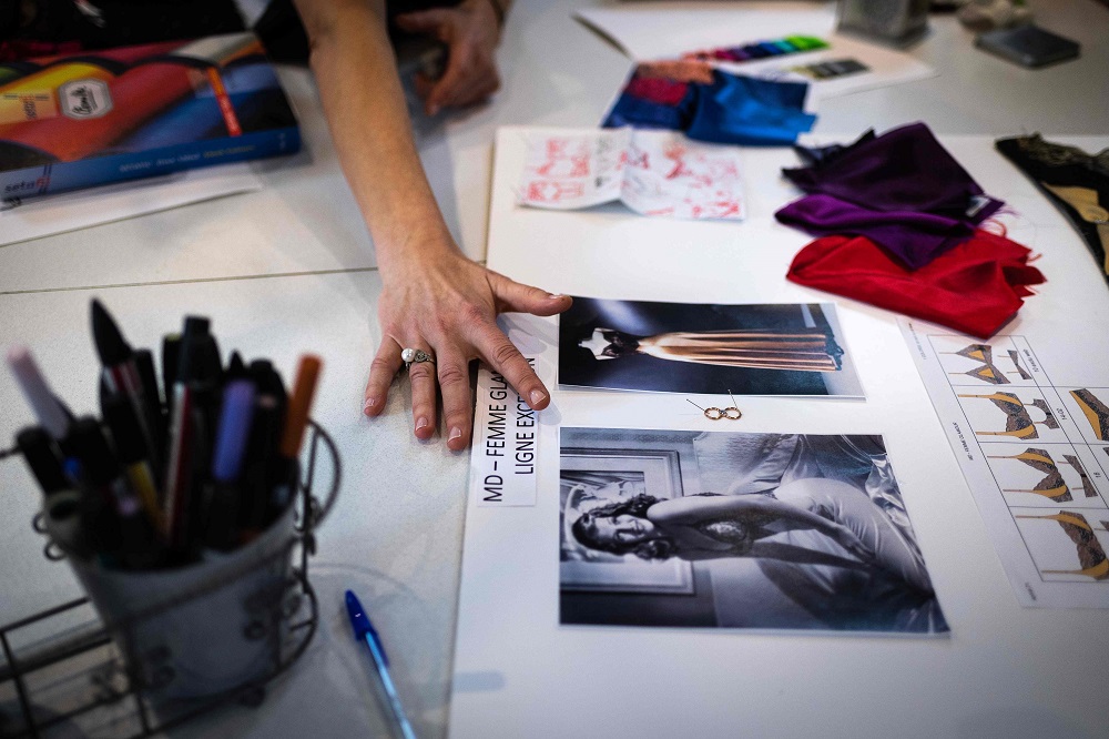 A person works on a product at the French feminine lingerie company Aubade headquarters in Paris January 4, 2019. u00e2u20acu201d AFP pic