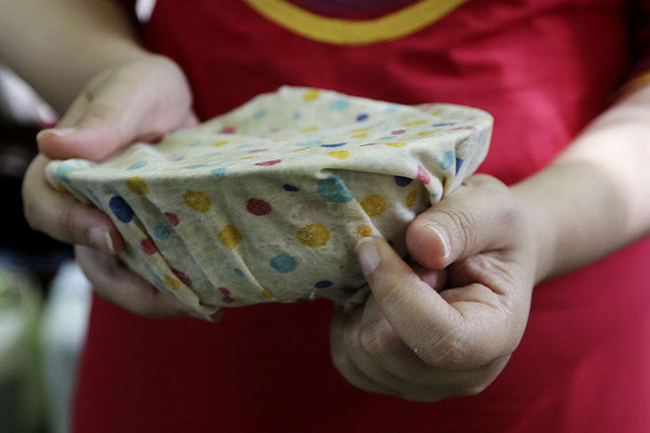 You need to place the beeswax wrap over a bowl and from the warmth of your hands, the wax will melt and create a seal.