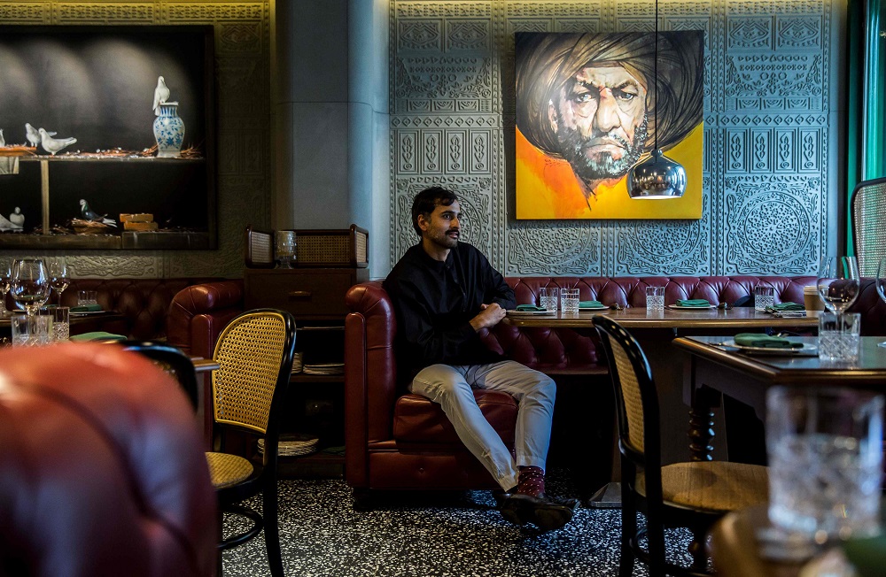 This picture taken on January 16, 2019, shows Hong Kong restaurateur Asim Hussain sitting at a table in his restaurant, the New Punjab Club in Hong Kong. — AFP pic        