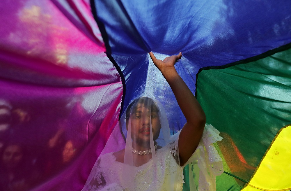 A participant touches a rainbow flag during Queer Pride March, an event promoting gay, lesbian, bisexual and transgender rights, in New Delhi November 25, 2018. u00e2u20acu2022 Reuters pic     