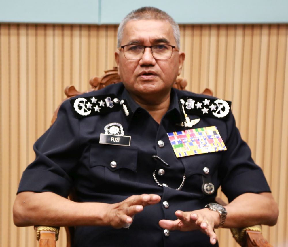 Tan Sri Mohamad Fuzi Harun said action will be taken against police personnel found flouting the law. u00e2u20acu201d Picture By Roysten Rueben