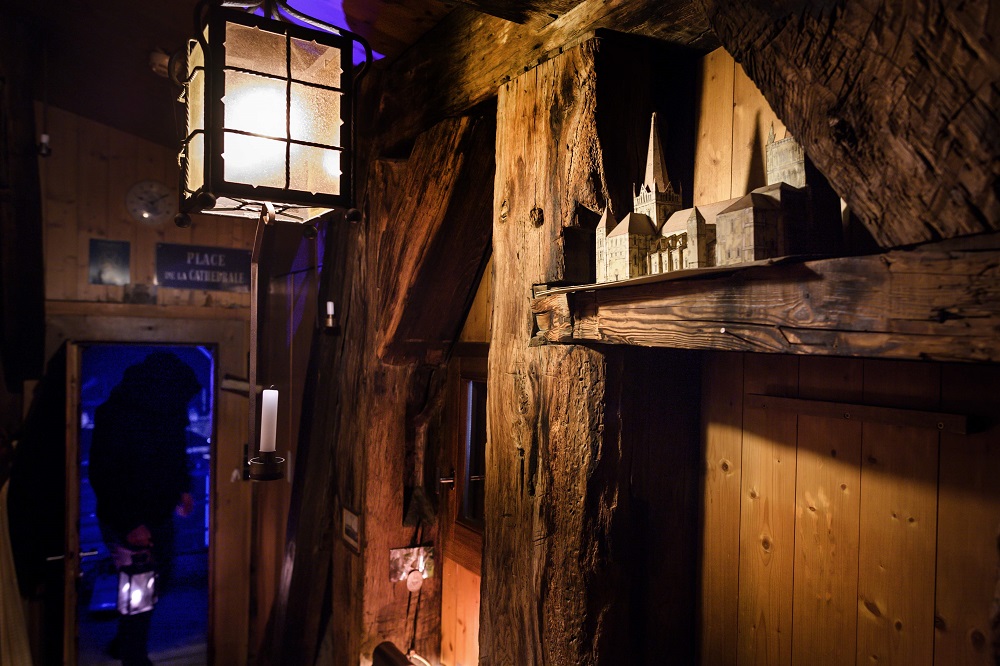 A model of the Cathedral of Notre Dame of Lausanne is seen as Marco Carrara, a replacement watchman, leaves his shelter on December 17, 2018 in Lausanne. ― AFP pic