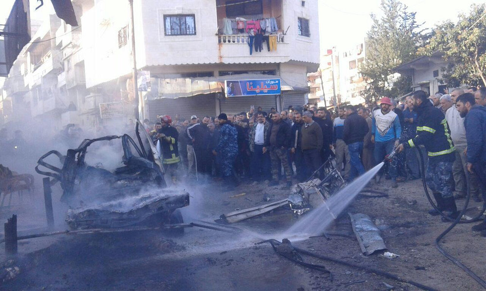 People gather at a site of a car bomb blast at the Syrian city of Latakia, Syria in this handout released by SANA on January 22, 2019 . u00e2u20acu201d Reuters pic