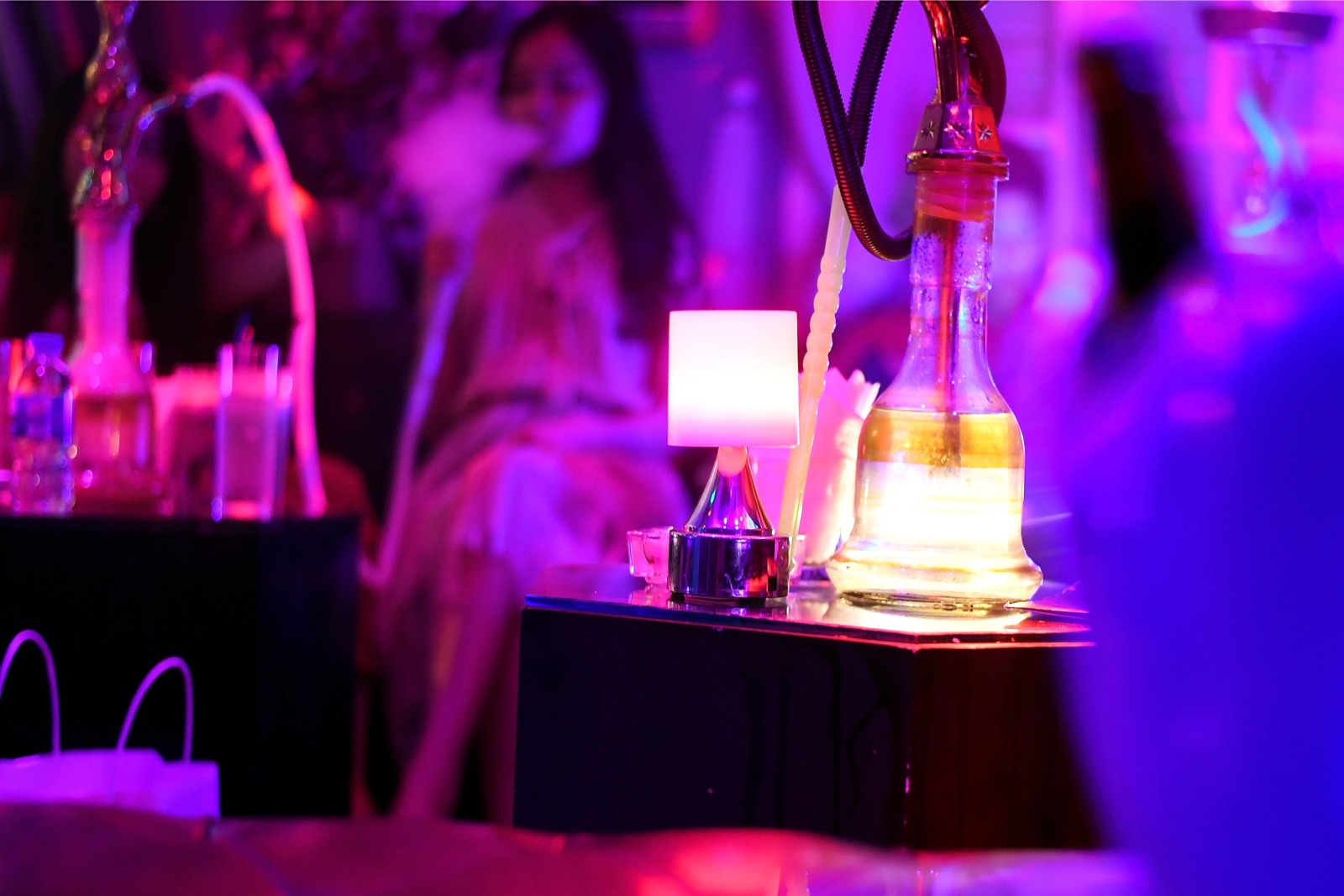 In this picture taken on September 22, 2018 a Vietnamese women smokes a u00e2u20acu02dcshishau00e2u20acu2122 at a nightclub in Hanoi. u00e2u20acu201d AFP pic