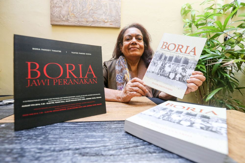 Professor Datuk Dr Wazir Jahan Karim poses with a copy of her book u00e2u20acu02dcBoriau00e2u20acu2122 at Jawi House, George Town January 28, 2019. u00e2u20acu201d Picture Sayuti Zainudin