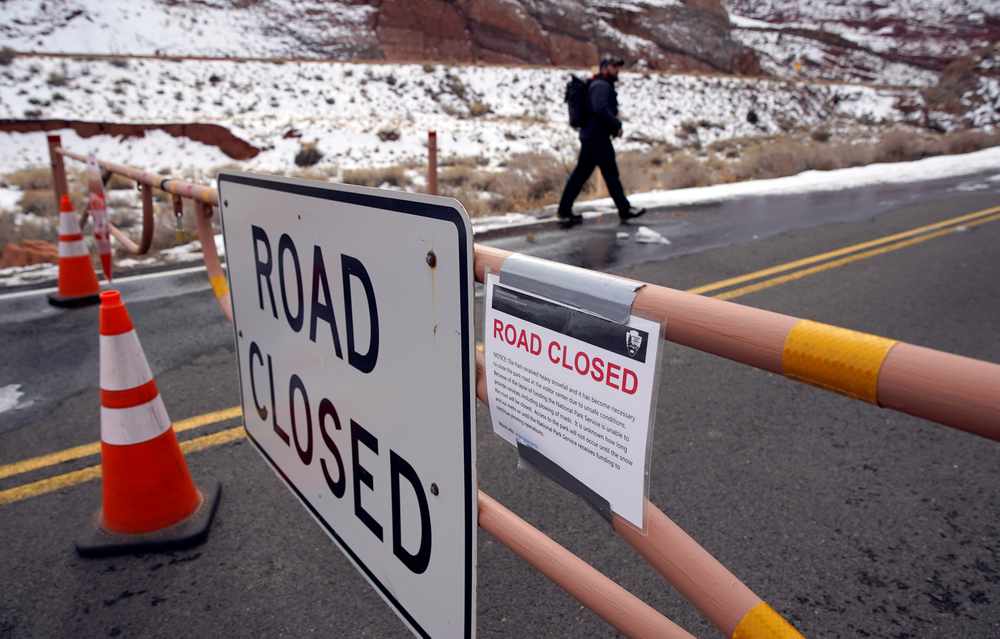 A hiker walks past the main road gate, which is closed because of the partial government shutdown, in Arches National Park, Utah January 9, 2019.  u00e2u20acu201d Reuters pic
