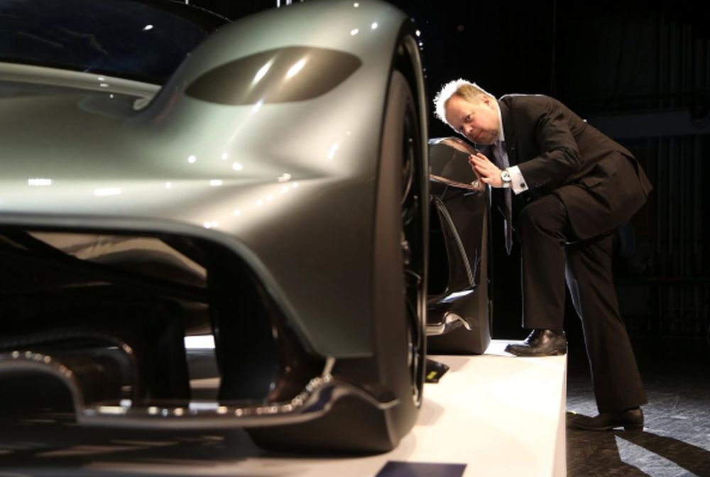 Aston Martin CEO Andy Palmer peers down the lines of a display model of a AM-RB 001 in Toronto, Ontario, Canada, February 15, 2017. u00e2u20acu201d Reuters pic