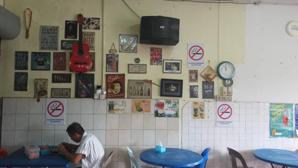 Many local eateries and coffee shops in Kota Kinabalu have complied with the federal government anti smoking laws to put up no smoking signs but are not actively banning smoking in their outlets. u00e2u20acu201d Picture by Julia Chan