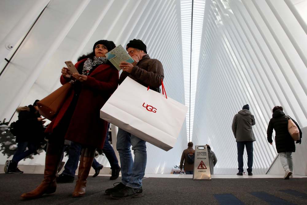 People carry shopping bags during Black Friday sales events at the Westfield World Trade Center in New York November 23, 2018. u00e2u20acu201d Reuters pic