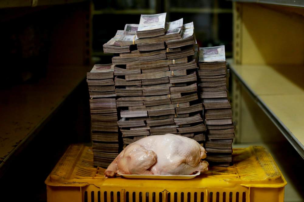 A 2.4 kg chicken is pictured next to 14,600,000 bolivars, its price and the equivalent of US$2.22, at a mini-market in Caracas, Venezuela August 16, 2018. u00e2u20acu201d Reuters pic 