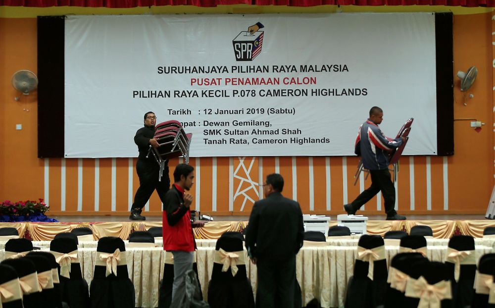 Volunteers setting up the nomination centre at Dewan Gemilang SMK Sultan Ahmad Shah ahead of  nomination day for the Cameron Highland by-election, January 11, 2019. u00e2u20acu2022 Picture by Farhan Najib