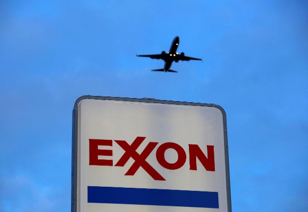 An airplane comes in for a landing above an Exxon sign at a gas station in the Chicago suburb of Norridge, Illinois, US, October 27, 2016. u00e2u20acu201d Reuters pic