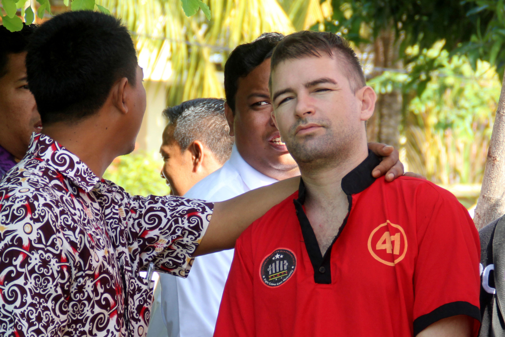 This picture taken on December 21, 2018 shows Frenchman Felix Dorfin under escort as he was brought to a ceremony where Indonesian officials destroyed drugs seized in 2018, in Mataram, Lombok. u00e2u20acu201d AFP pic