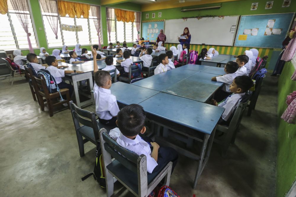 Students attend the first day of school at Sekolah Kebangsaan Shah Alam January 2, 2019. u00e2u20acu2022 Picture by Yusof Mat Isa