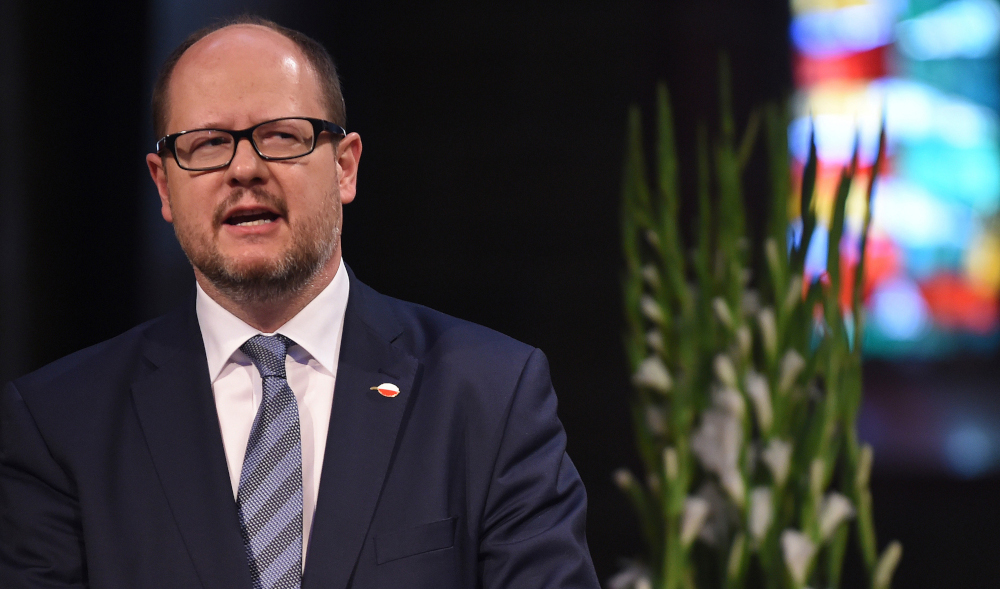 Picture taken on May 5, 2016 shows the mayor of Gdansk Pawel Adamowicz giving a speech during a commemorative ceremony at the St Petri Dom cathedral in Bremen, northwestern Germany. u00e2u20acu201d AFP pic