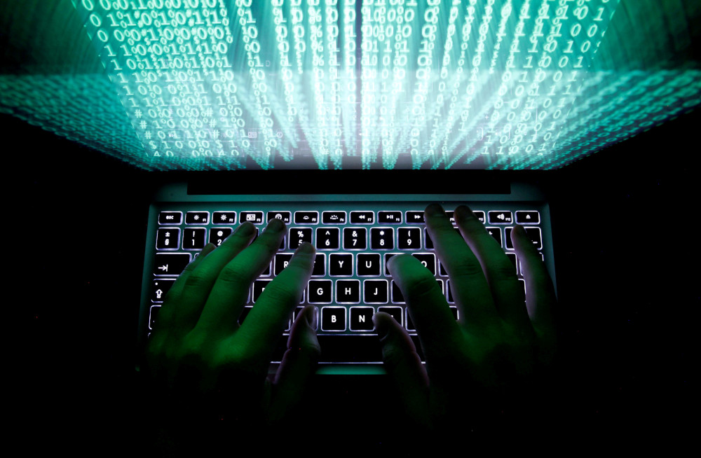 A man types on a computer keyboard in this illustration picture February 28, 2013. u00e2u20acu201d Kacper Pempel/Illustration via Reuters n   REUTERS/Kacper Pempel/Illustration/File Photo/File Photon