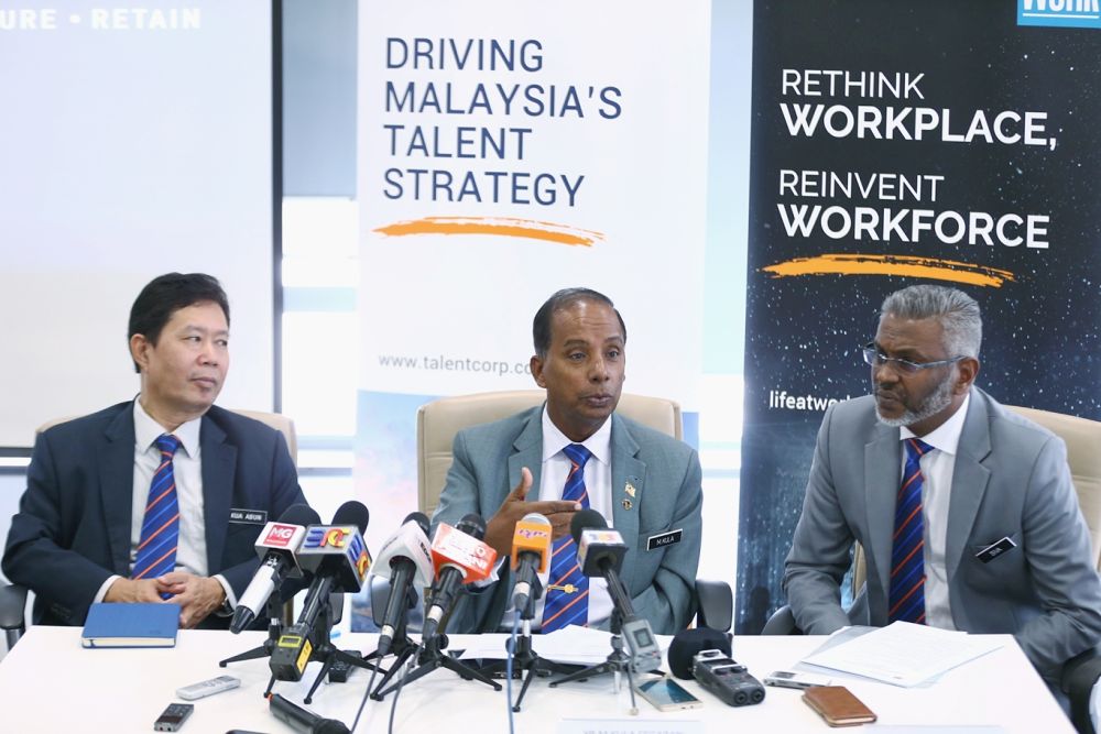 Human Resources Minister M. Kulasegaran (centre) speaks to reporters during a visit to TalentCorpu00e2u20acu2122s office in Kota Damansara January 23, 2019. u00e2u20acu201d Picture by Ahmad Zamzahuri