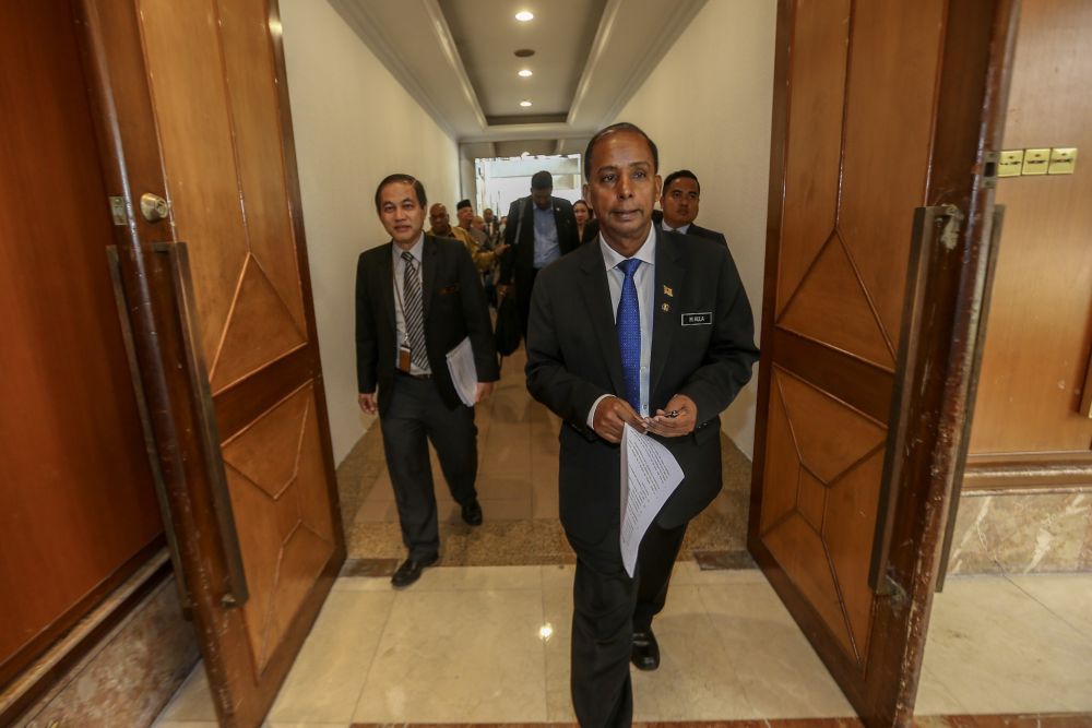 Human Resource Minister M. Kulasegaran (centre) leaves after chairing the National Workers Advisory Council meeting in Subang Jaya January 18, 2019. u00e2u20acu2022 Picture by Hari Anggara