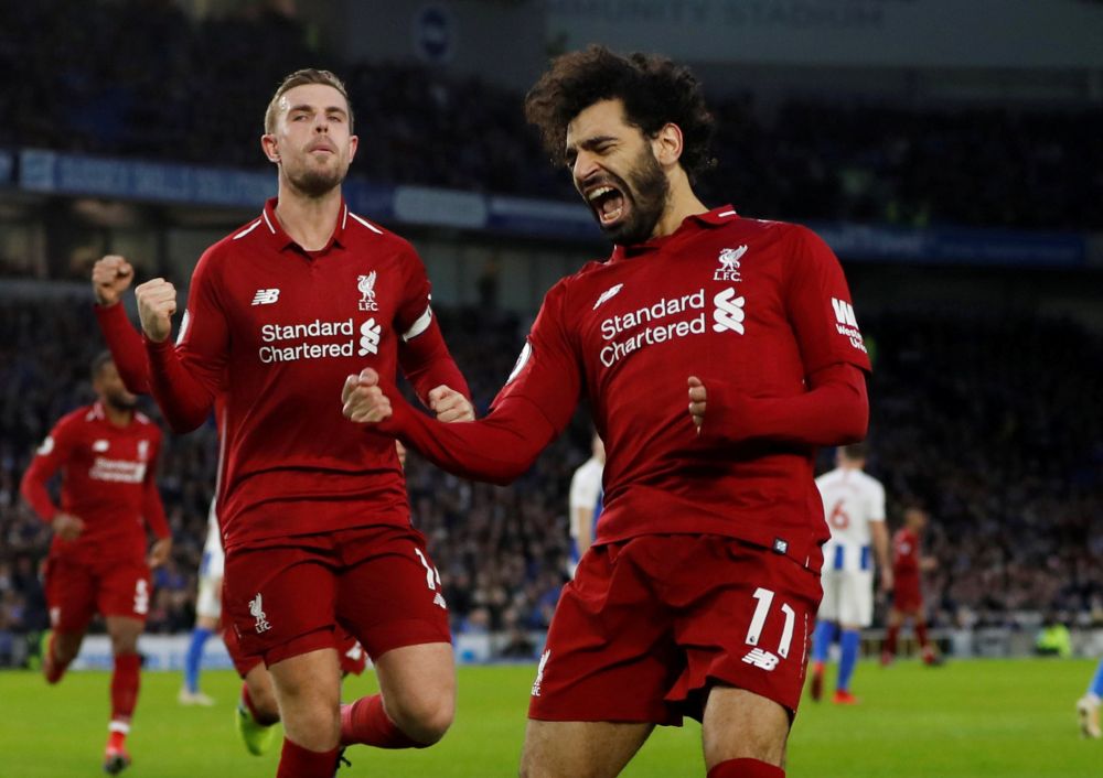 Liverpool's Mohamed Salah celebrates scoring against Brighton with Jordan Henderson. u00e2u20acu2022 Reuters pic