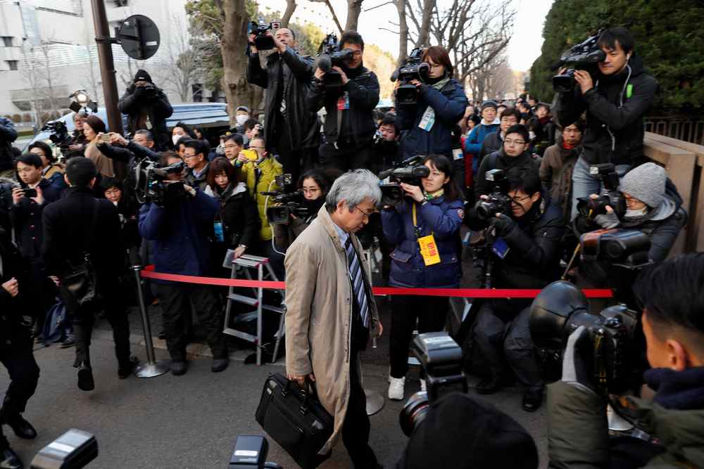 Motonari Otsuru, chief lawyer of the ousted Nissan Motor Co Ltd chairman Carlos Ghosn, is surrounded by reporters as he arrives at the Tokyo District Court January 8, 2019. u00e2u20acu201d Reuters pic