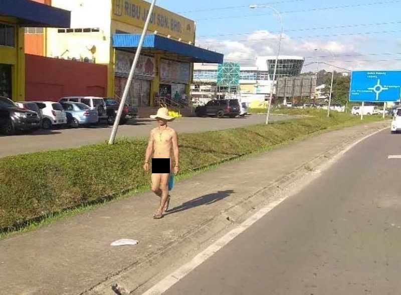 A photo of a naked man walking along Jalan Bundusan near Pavillion Bundusan is capturing attention. u00e2u20acu201d Screengrab via WhatsApp