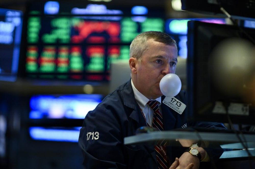 A trader makes a bubble with a chewing gum ahead of the closing bell on the floor of the New York Stock Exchange (NYSE) on January 29, 2019 in New York City. u00e2u20acu201d AFP pic