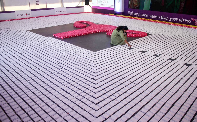 This photo taken on January 10, 2019 shows an Indian woman arranging sanitary napkins during an attempt to enter the Guinness World Record. u00e2u20acu201d AFP picnn