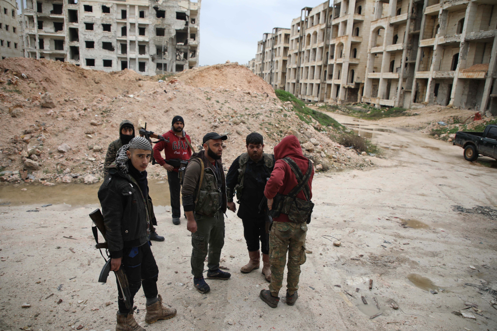 Syrian fighters from the Turkish-backed National Liberation Front (NLF) patrol in al-Zahra neighbourhood, on the northwestern outskirts of the northern city of Aleppo on January 15, 2019. u00e2u20acu201d AFP pic