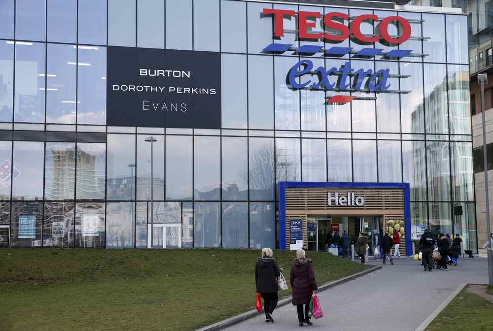People walk past a Tesco Extra store in Woolwich, south-east London February 26, 2016. u00e2u20acu201d Reuters pic