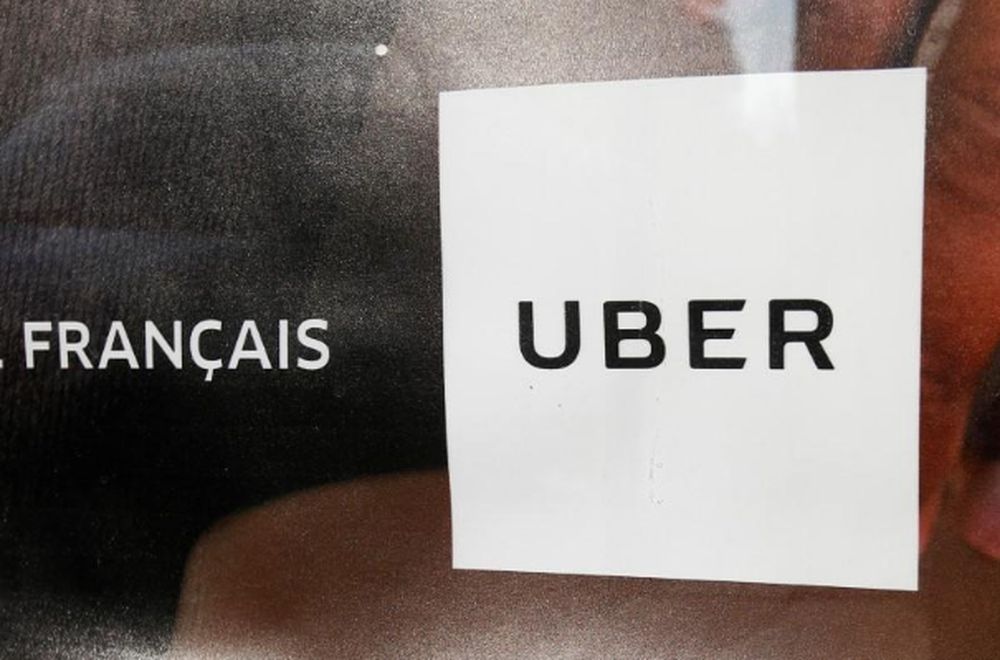An advertisement for the Uber car and ride-sharing service Uber is seen on a bus stop in Paris, France, March 11, 2016. u00e2u20acu201d Reuters pic