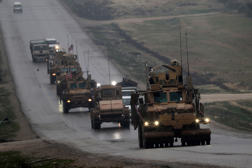 In this file photo taken on December 30, 2018 a convoy of US military vehicles rides in Syriau00e2u20acu2122s northern city of Manbij. u00e2u20acu201d AFP pic