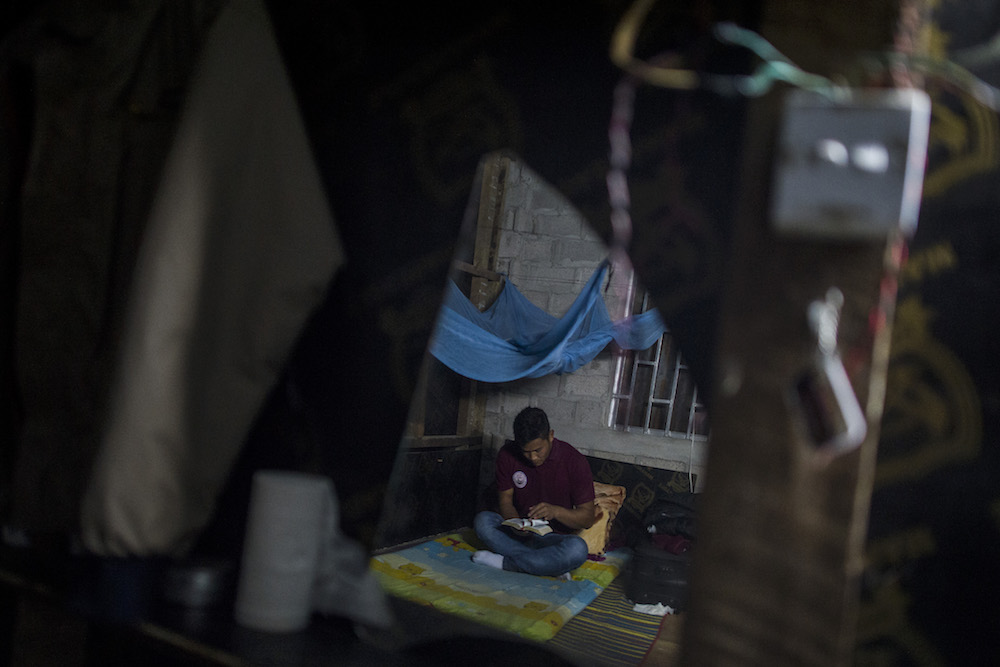 A drug user reads a book at a drug rehabilitation centre in Lashio, Shan State January 9, 2019. — AFP pic