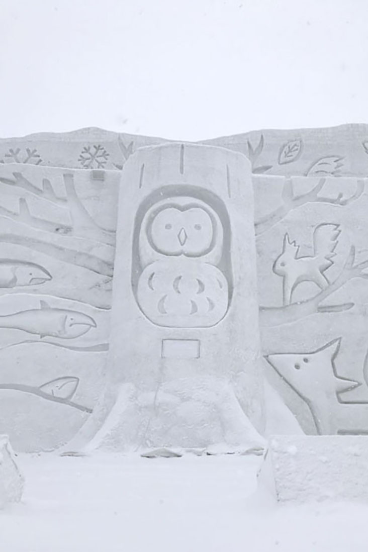 This wise owl is at the heart of the giant snow sculpture.
