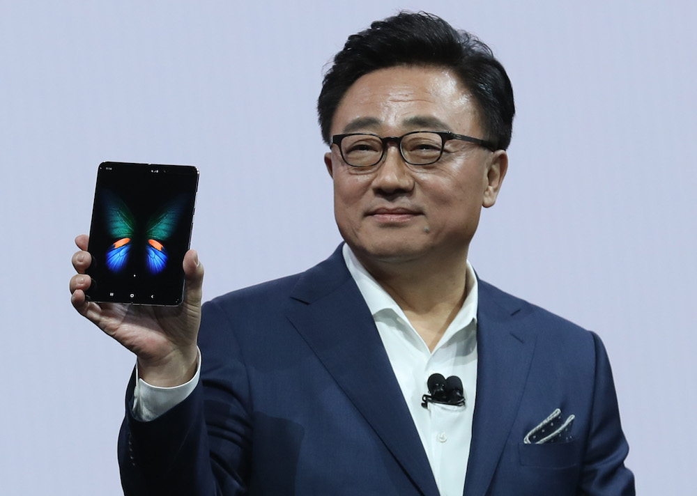 Samsungu00e2u20acu2122s Mobile Division President and CEO DJ Koh holds the new Samsung Galaxy Fold smartphone during the Samsung Unpacked event in San Francisco February 20, 2019. u00e2u20acu201d AFP pic