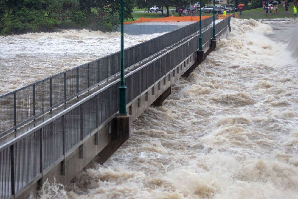 This picture provided to AFP February 3, 2019 shows floodwaters as they rush over the Aplins Weir in Townsville after days of torrential rain. u00e2u20acu201d Handout/Queensland Fire and Emergency Services pic via AFP