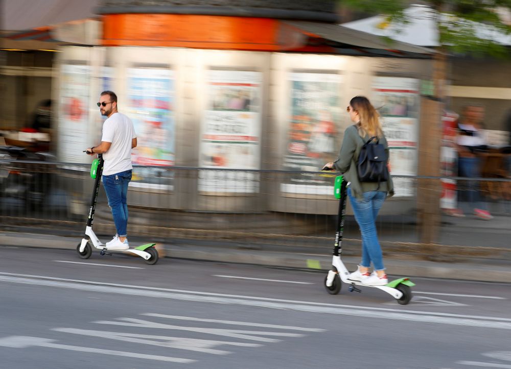 People ride dock-free electric scooters Lime-S by California-based bicycle and scooter sharing service Lime, on a street in Madrid, Spain, October 24, 2018. u00e2u20acu201d Reuters pic