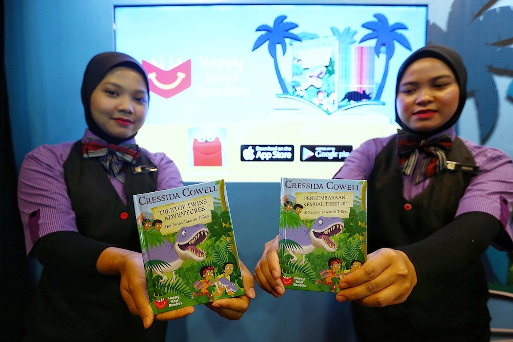 McDonaldu00e2u20acu2122s customers now get a free childrenu00e2u20acu2122s storybook with every purchase of the Happy Meal. u00e2u20acu201d Picture by Ahmad Zamzahuri