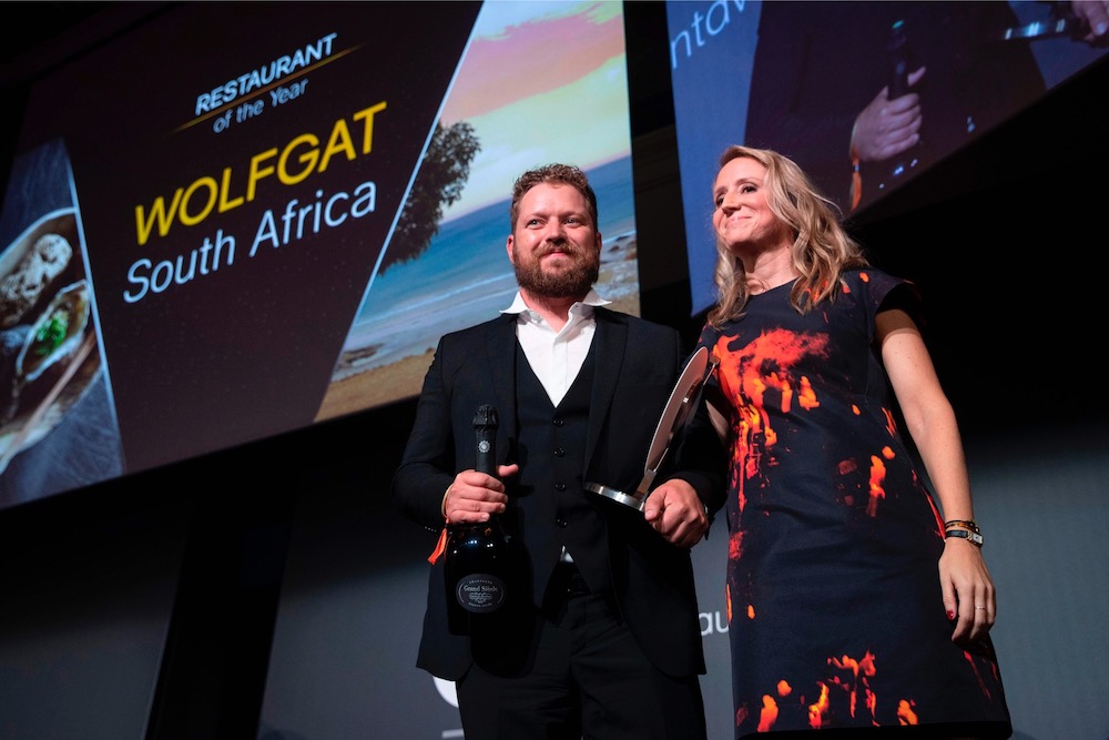 Chef Kobus van der Merwe (left) receives the best Restaurant of the year award for his restaurant u00e2u20acu02dcWolfgatu00e2u20acu2122 in South Africa during the inaugural World Restaurant Awards at the Palais Brongniart in Paris February 18, 2019. u00e2u20acu201d AFP pic