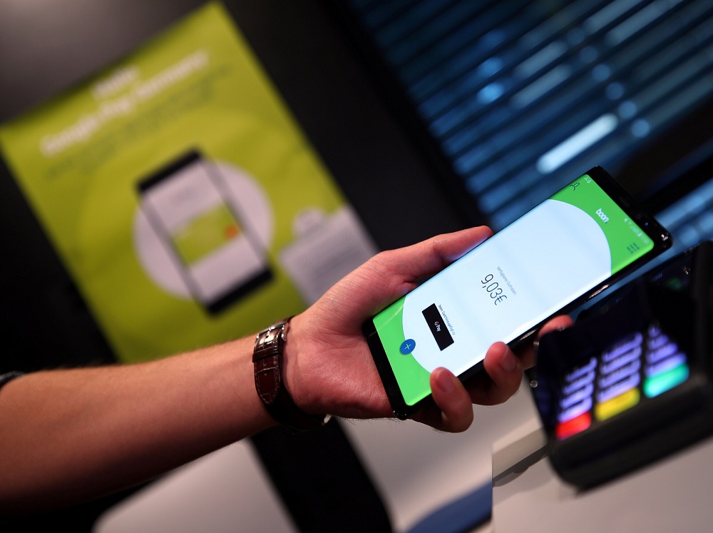 An employee of Wirecard AG presents the contactless payment system u00e2u20acu02dcboonu00e2u20acu2122 at the companyu00e2u20acu2122s headquarters in Aschheim near Munich September 6, 2018. u00e2u20acu201d Reuters pic