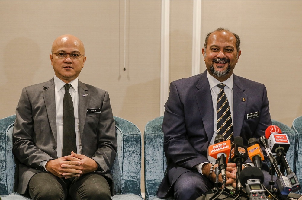 Communications and Multimedia Minister Gobind Singh Deo (right) and MCMC chairman Al-Ishsal Ishak speaks during a press conference at JW Marriot Hotel December 3, 2018. u00e2u20acu201d Picture by Firdaus Latif