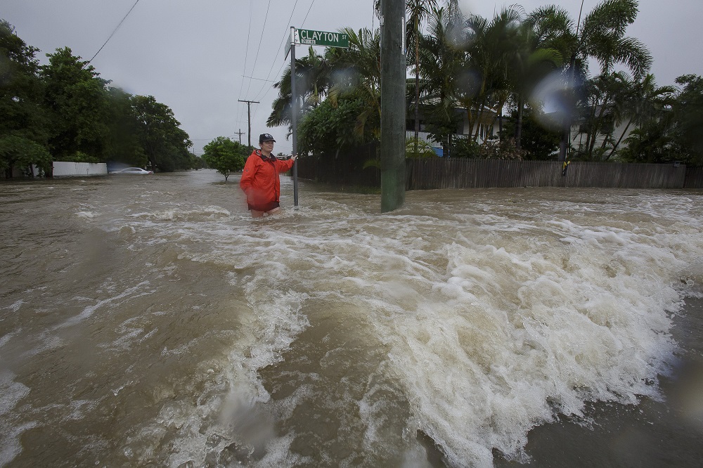 A woman stands in flooded waters in Hermit Park, Townsville in Queensland, Australia February 3, 2019. u00e2u20acu201d Picture by AAP Image/Andrew Rankin via Reuters 