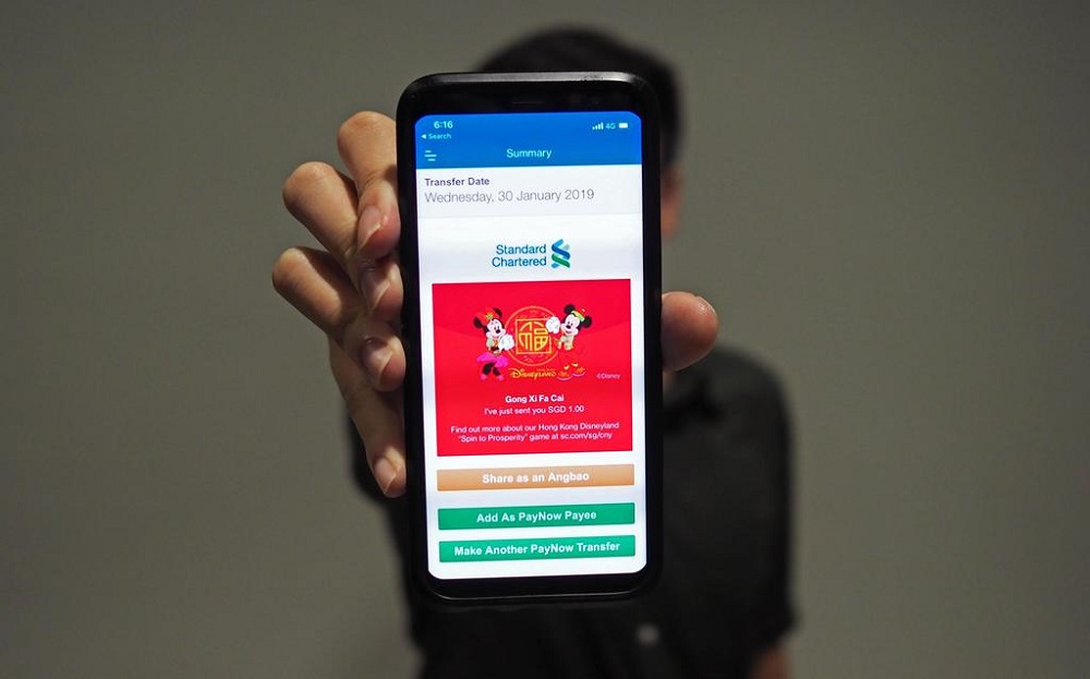 Standard Chartered Bank has partnered with Hong Kong Disneyland for its new e-angpow this year. u00e2u20acu201d TODAY pic