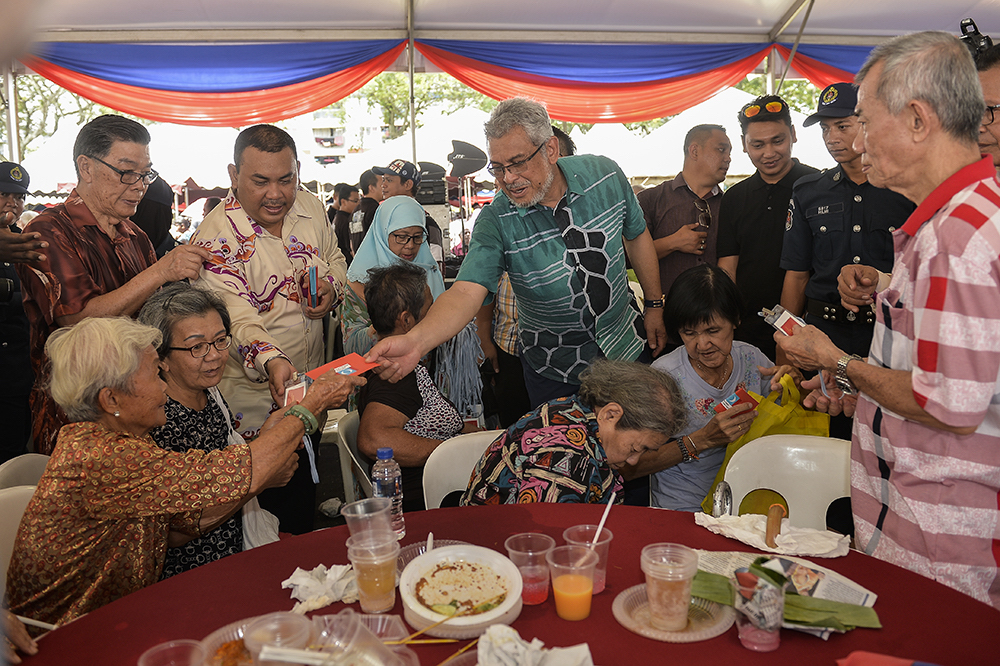 Federal Territories Minister Khalid Samad greets guests during u00e2u20acu02dcKenduri Rakyatu00e2u20acu2122 in Kuala Lumpur February 10, 2019. u00e2u20acu201d Picture by Miera Zulyana