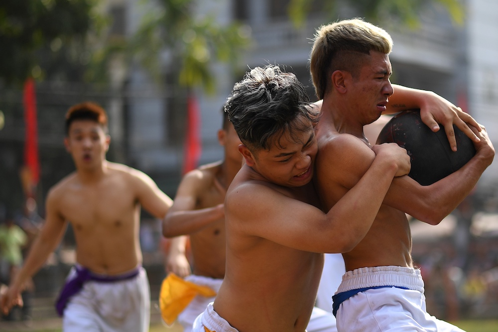Vietnamese men competing for the prized jackfruit wooden ball during the traditional Vat Cau or ball wrestling festival on the fifth day of Lunar New Year celebrations at Hanoi February 9, 2019. u00e2u20acu201d AFP pic 