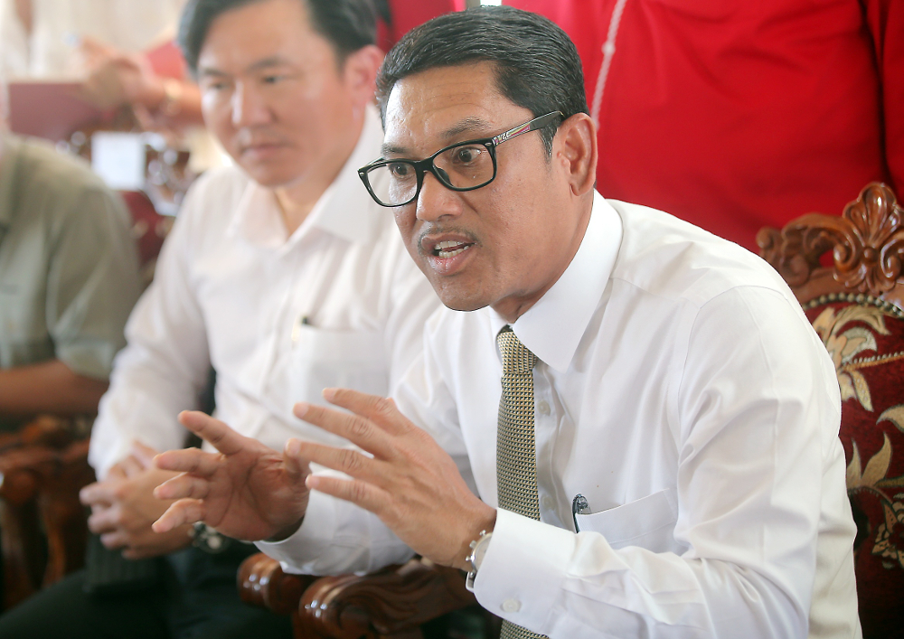 Perak Mentri Besar Datuk Seri Ahmad Faizal Azumu speaking to press after attending the handing over of house key ceremony for the People Housing Programme (PPR) at Seri Iskandar February 12, 2019. u00e2u20acu201d Picture by Farhan Najib 