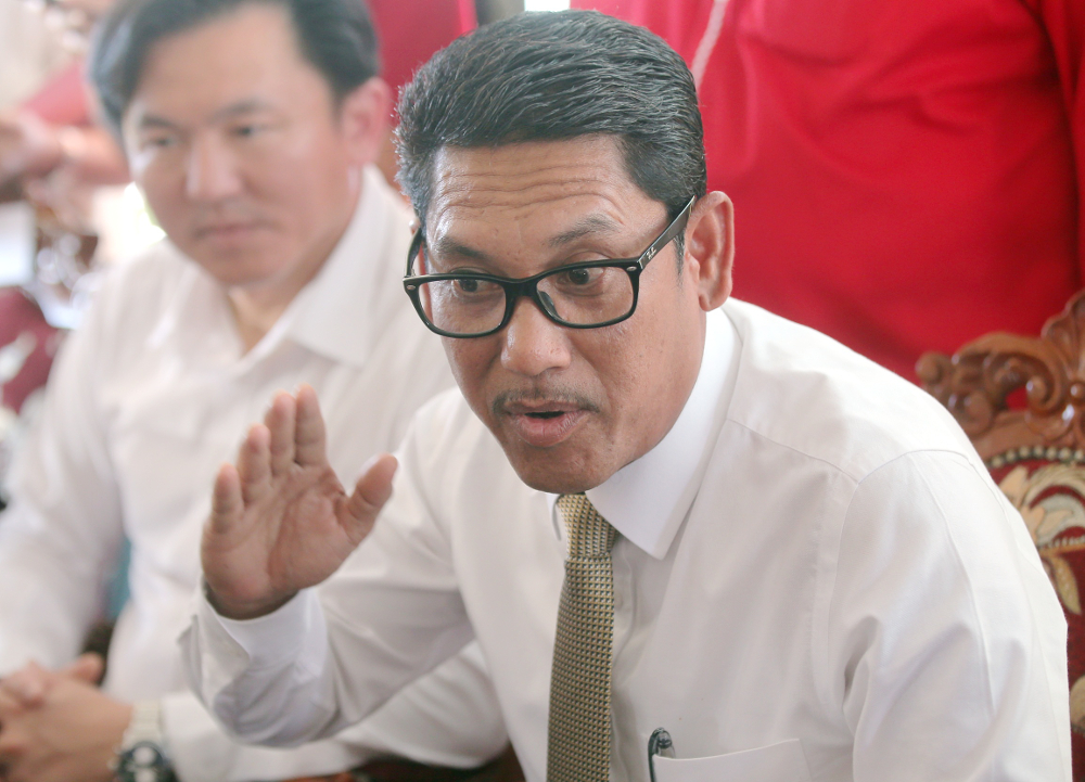 Perak Mentri Besar Datuk Seri Ahmad Faizal Azumu speaking to press after attending the handing over of house key ceremony for the People Housing Programme (PPR) at Seri Iskandar February 12, 2019. u00e2u20acu201d Picture by Farhan Najib 