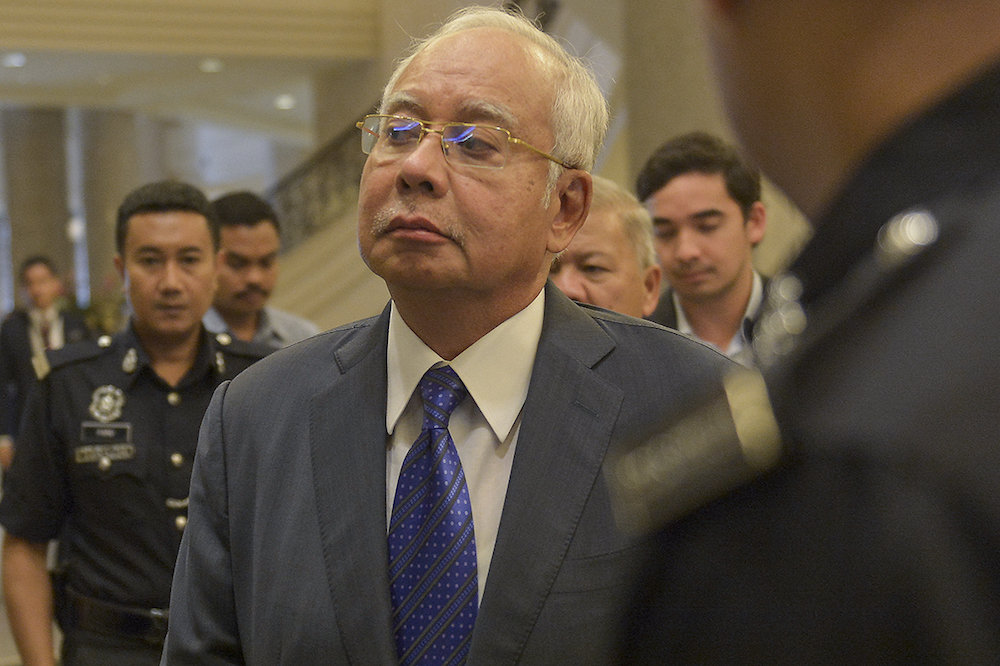 Datuk Seri Najib Razak and his son Noorashman Najib are seen at the Palace of Justice in Putrajaya February 11, 2019. u00e2u20acu201d Picture by Mukhriz Hazim