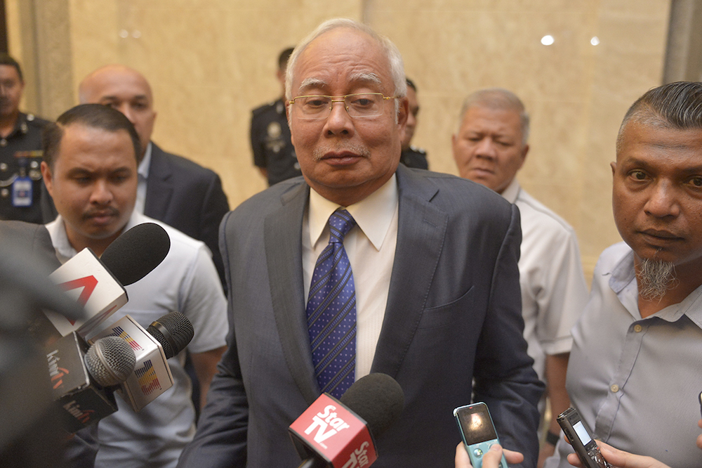 Datuk Seri Najib Razak reacts to questions from reporters at the Palace of Justice in Putrajaya February 11, 2019. u00e2u20acu201d Picture by Mukhriz Hazim