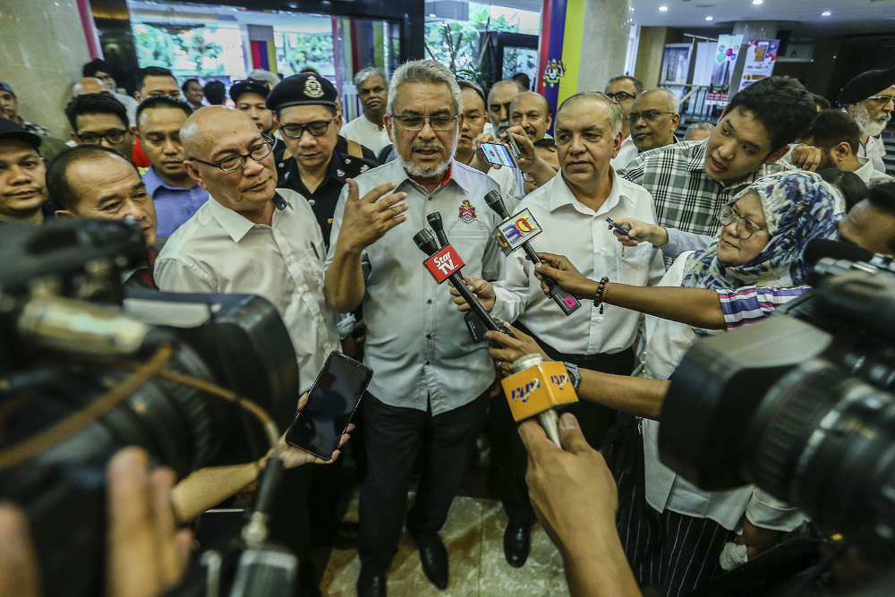 Federal Territories Minister Khalid Samad (centre) speaks to reporter after a visit to Jalan Tuanku Abdul Rahman in Kuala Lumpur February 19, 2019. u00e2u20acu201d Picture by Hari Anggara
